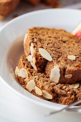 Piece of banana bread, close up, white background.