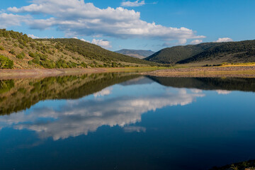 Fototapeta na wymiar Reflections on the Still Waters of Foryth Reservoir, Dixie National Forest, Utah, USA