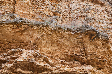 Abstract textured or Falling stones. Rocks background. Fracture in ground. Natural material. Sharp cliff. Copy space