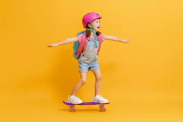 Gordijnen Cute child with skateboard © Konstantin Yuganov
