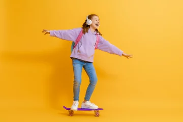 Poster Cute child with skateboard © Konstantin Yuganov