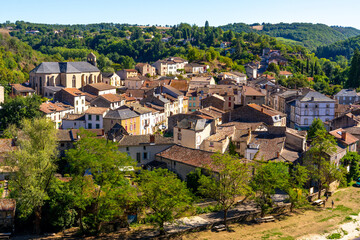 Fototapeta na wymiar Beautiful top view of the French village of Laguepie. Old catholic cathedral. Orange tiled roofs. 