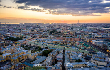Fototapeta premium Aerial view of the city at sunset in Saint Petersburg, Panorama of the Fontanka River and the bridges across it. View of the city from above. Cities of Russia. Petersburg in the summer.