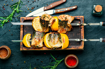 Barbecue mackerel fish on skewers