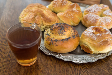 Naklejka na ściany i meble fresh tasty homemade buns with cup of coffee