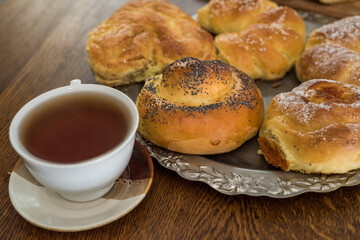 fresh tasty homemade buns with cup of coffee