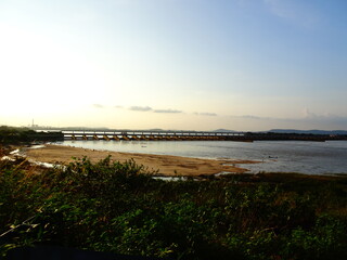 Sunset landscape view of Naraj Barrage with flood gates on Mahanadi river when human meets nature