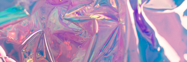 Pink defocused hologram banner. Crumpled foil material. Abstract liquid surface.