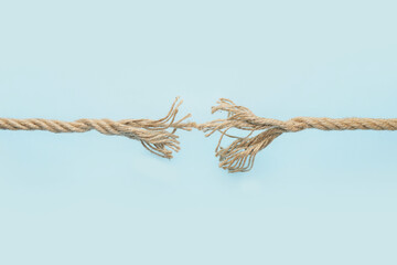 Frayed rope on color background