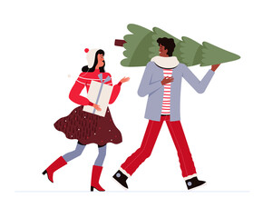 Cheerful man and woman in festive clothes carry a Christmas tree and a gift and communicate. People are preparing for Christmas