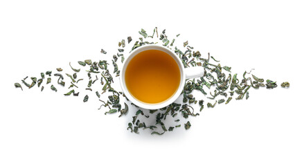 Cup of tea with dry leaves on white background