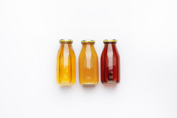 Bottles of juices on white background