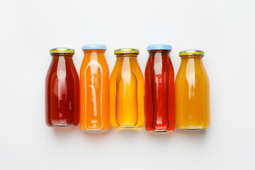 Bottles of juices on white background