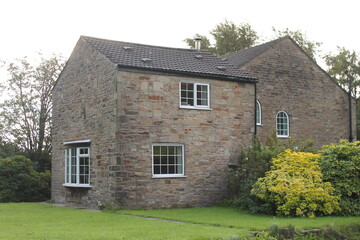 Fototapeta na wymiar Typical English stone built house