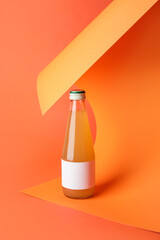 Bottle of juice on color background