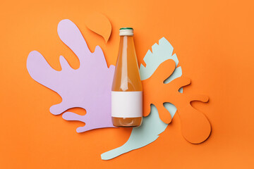 Bottle of juice on color background