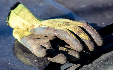 Dirty gloves of a construction worker