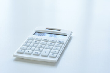  Calculator on a white desk
