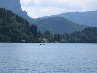 Fototapeta na wymiar Lake Bled, Slovenia, Julian Alps, Island, Green mountains forest