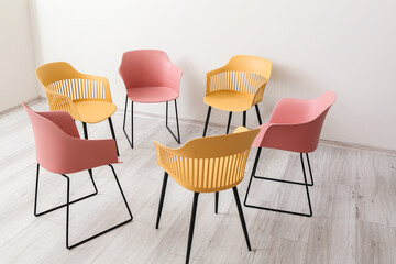 Empty chairs prepared for group therapy in psychologist's office