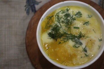 A bowl of yellow soup