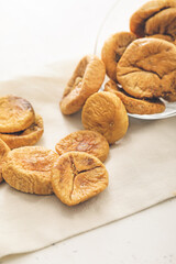 Tasty dried figs on light background