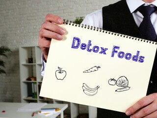 Healthy concept meaning Detox Foods with sign on the page.