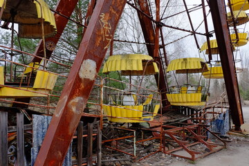 Fragment of an old broken Ferris wheel in the abandoned city of Pripyat. An abandoned amusement park.
