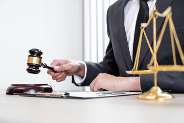 Judges gavel, Professional male lawyers work at a law office There are scales, Scales of justice, judges gavel, and litigation documents. Concepts of law and justice