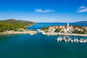 Fototapeta na wymiar Beautiful old historic town of Osor with bridge connecting islands Cres and Losinj, Croatia, aerial view from drone 
