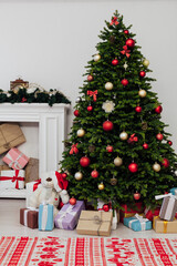 The interior of the room is a green Christmas tree with red gifts for the new year decor winter holiday