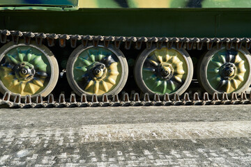 closeup of tank chassis, tracks and rollers