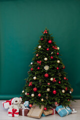 interior of the house with Christmas green Christmas tree decorations and gifts