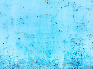 Creative background of rusty metal, painted gray paint carelessly with the remnants of torn paper. Grungy metal surface. Great background or texture for your project.