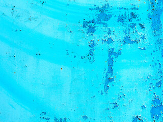 Creative background of rusty metal, painted gray paint carelessly with the remnants of torn paper. Grungy metal surface. Great background or texture for your project.