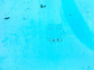 Creative background of rusty metal, painted gray paint carelessly with the remnants of torn paper....