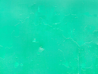Creative background of rusty metal, painted gray paint carelessly with the remnants of torn paper....