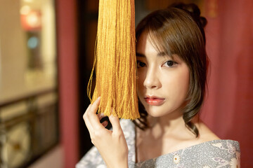 Young woman in traditional Japanese kimono, Japanese concept of kimono and yukata.