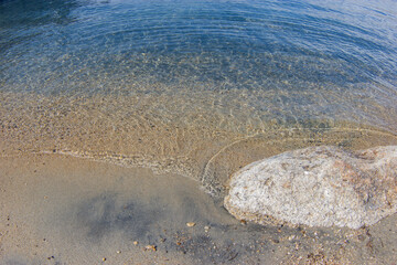 Stone in the sand on the shore