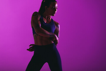 Fit woman doing warm up exercises