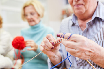 Seniors with knitting while crocheting as a hobby