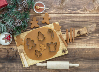 Top view on rolled out dough for christmas gingerbread cookies with holidays decorations