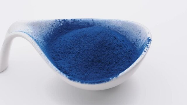 Blue Majik: blue powder extract from spirulina algae. Dietary supplement. Rotating table, seamless loop. 
