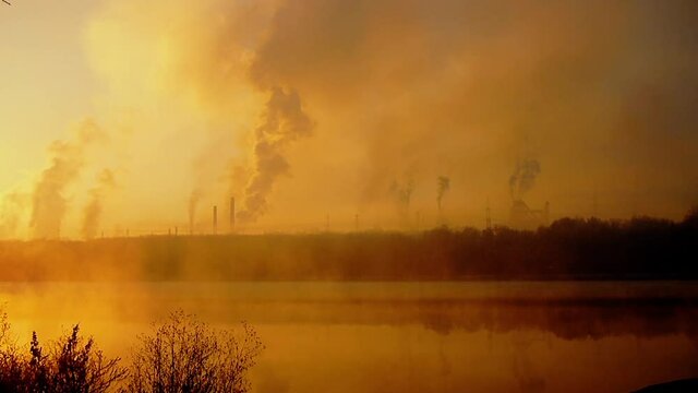 Air pollution with toxic substances. Environmental damage. A cloud of harmful substances. Metallurgical factory background.