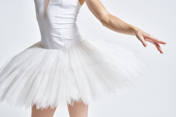 Naklejka premium Ballerina in white tutu elegant dance performed sensuality silhouette light background