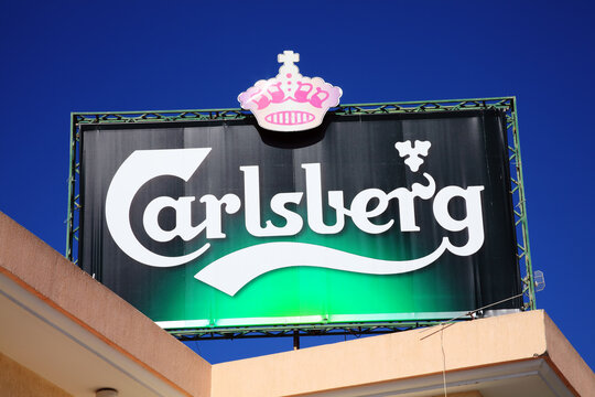 Paphos, Cyprus, February 26, 2013 : Carlsberg logo advertising sign on a public house restaurant  retail business stock photo image