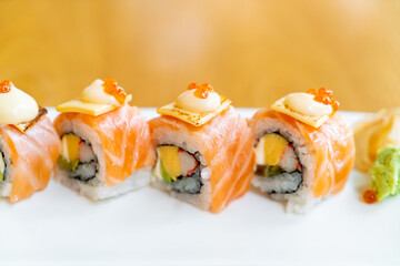 salmon roll sushi with cheese on top
