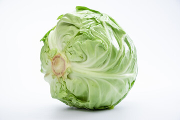 Fototapeta premium Healthy food, White cabbage close-up on a white background.