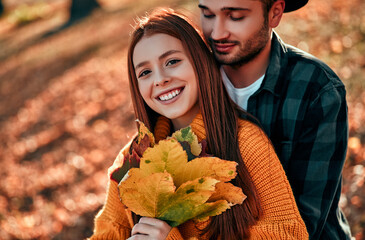 Couple in park in autumn
