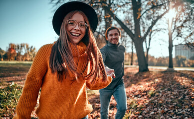 Couple in park in autumn